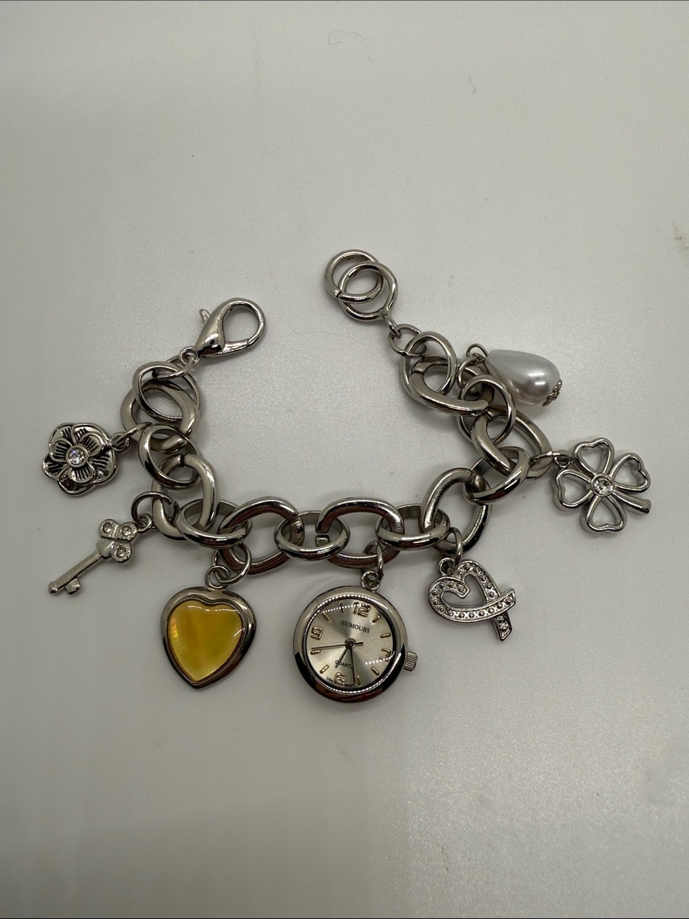 Rumours Silver-Tone Charm Bracelet Watch – Heart Clover Pearl Key